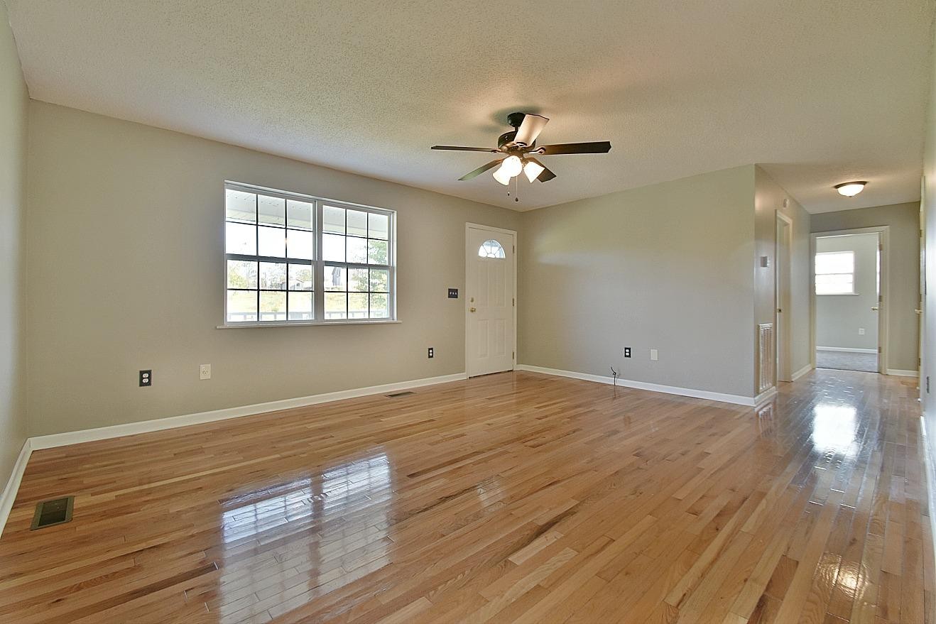 2880 Oakland Road Philadelphia, TN 37846 - Photo 3 of 27 a view of an empty room with a window and wooden floor