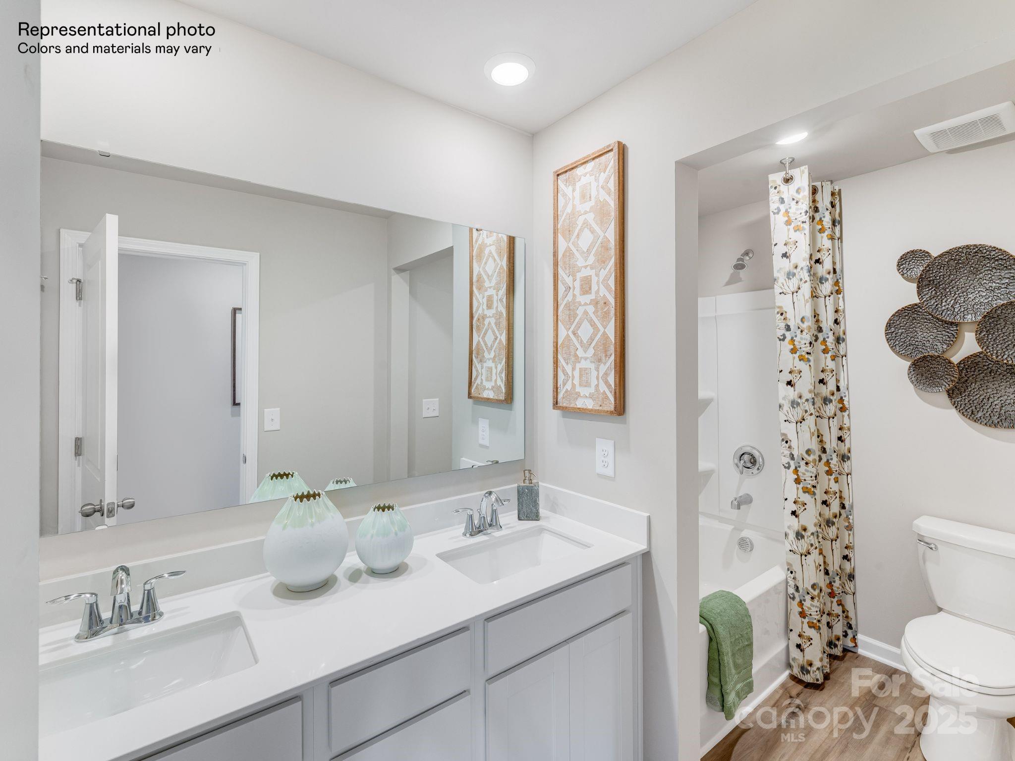1623 Spring Edgemoor Sc 29712 Edgemoor, SC 29712 - Photo 26 of 30 a bathroom with a sink toilet a mirror and shower