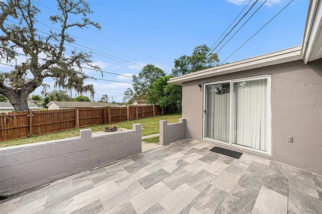 a backyard of a house with trampoline