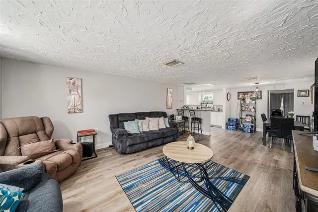 a living room with furniture and a table