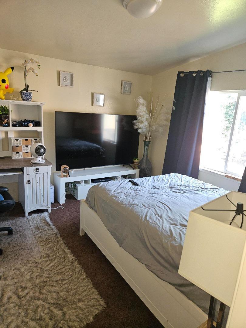 616 Gamma Court Campbell, CA 95008 - Photo 16 of 23 a bedroom with a bed and a flat screen tv