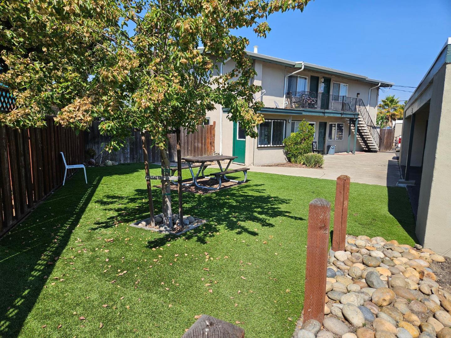 616 Gamma Court Campbell, CA 95008 - Photo 2 of 23 a front view of a house with a yard table and chairs