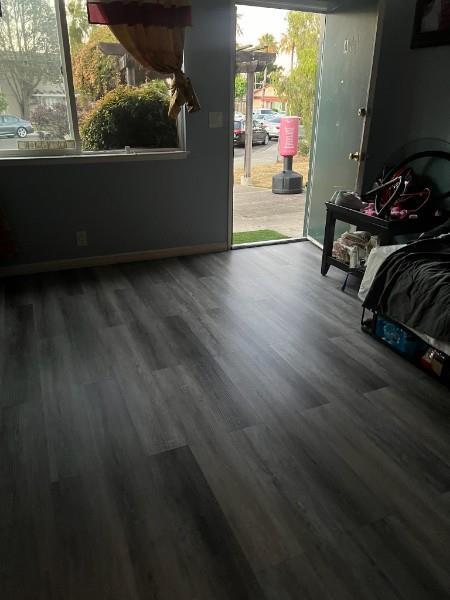 616 Gamma Court Campbell, CA 95008 - Photo 5 of 23 an empty room with wooden floor and windows