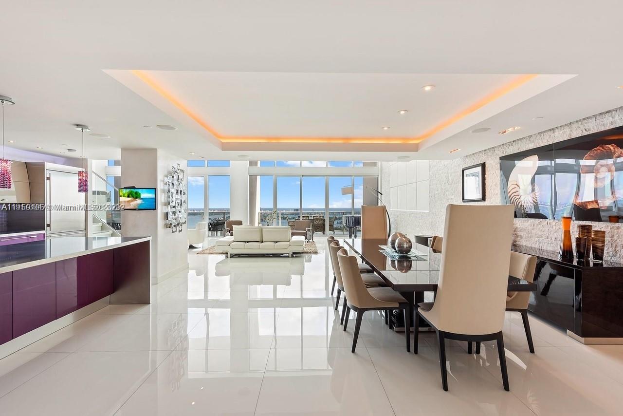 1040 Biscayne Boulevard, Unit 4403 Miami, FL 33132 - Photo 3 of 31 a view of a dining room with furniture