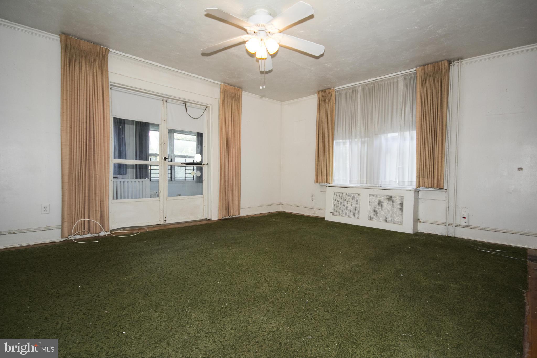 1803 Chelsea Road Baltimore, MD 21216 - Photo 14 of 30 a view of an empty room with a window