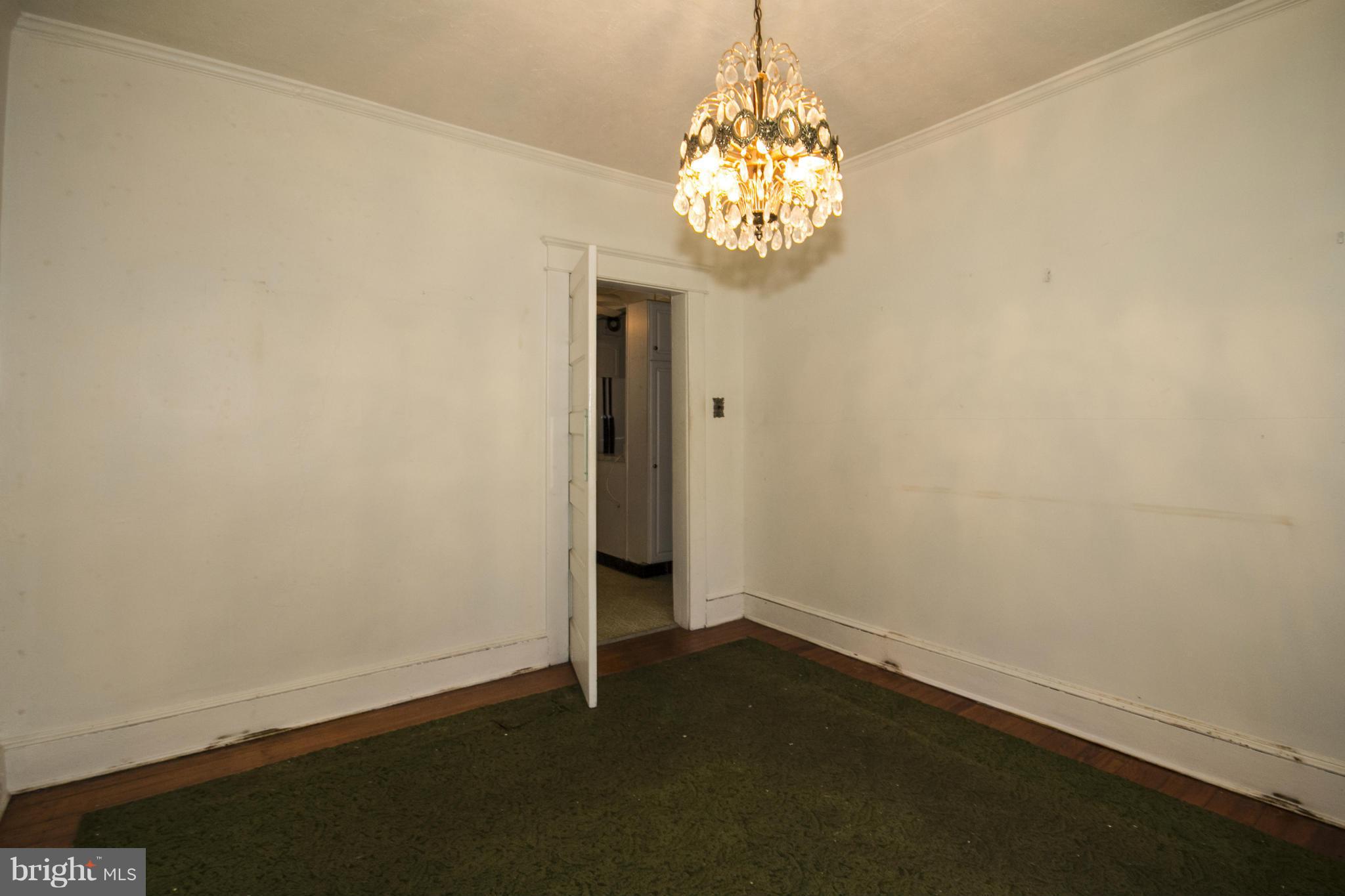 1803 Chelsea Road Baltimore, MD 21216 - Photo 8 of 30 a view of a chandelier in big room