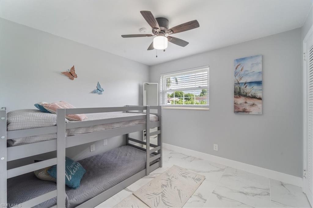 3999 Guava Drive Naples, FL 34104 - Photo 13 of 24 a view of room with window and a ceiling fan
