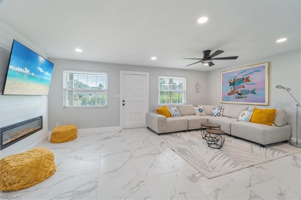 3999 Guava Drive Naples, FL 34104 - Photo 3 of 24 a living room with furniture and a window