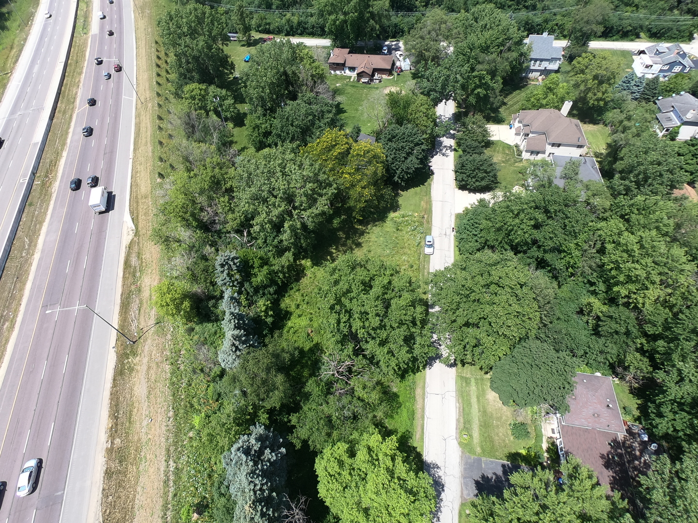 4N155 Niles Avenue Addison, IL 60101 - Photo 3 of 6 an aerial view of residential house with outdoor space and trees all around