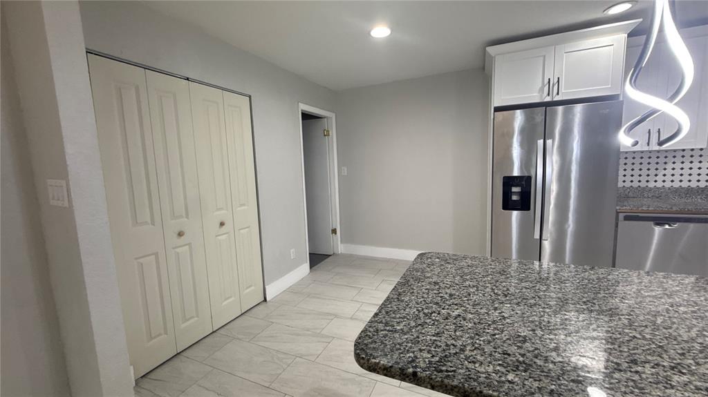 8106 Wichita Way Tampa, FL 33619 - Photo 6 of 21 a large bedroom with a bed in it