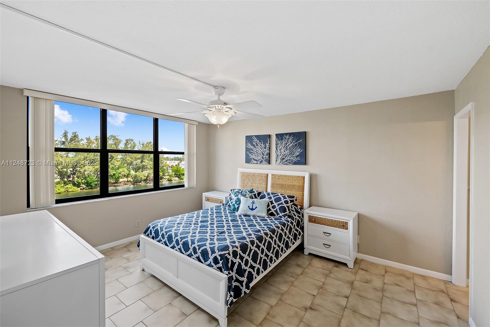 1401 North Riverside Drive, Unit 503 Pompano Beach, FL 33062 - Photo 17 of 30 a bedroom with a bed and window