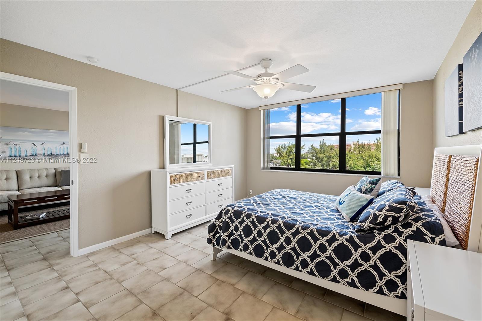 1401 North Riverside Drive, Unit 503 Pompano Beach, FL 33062 - Photo 19 of 30 a bedroom with a bed and a window