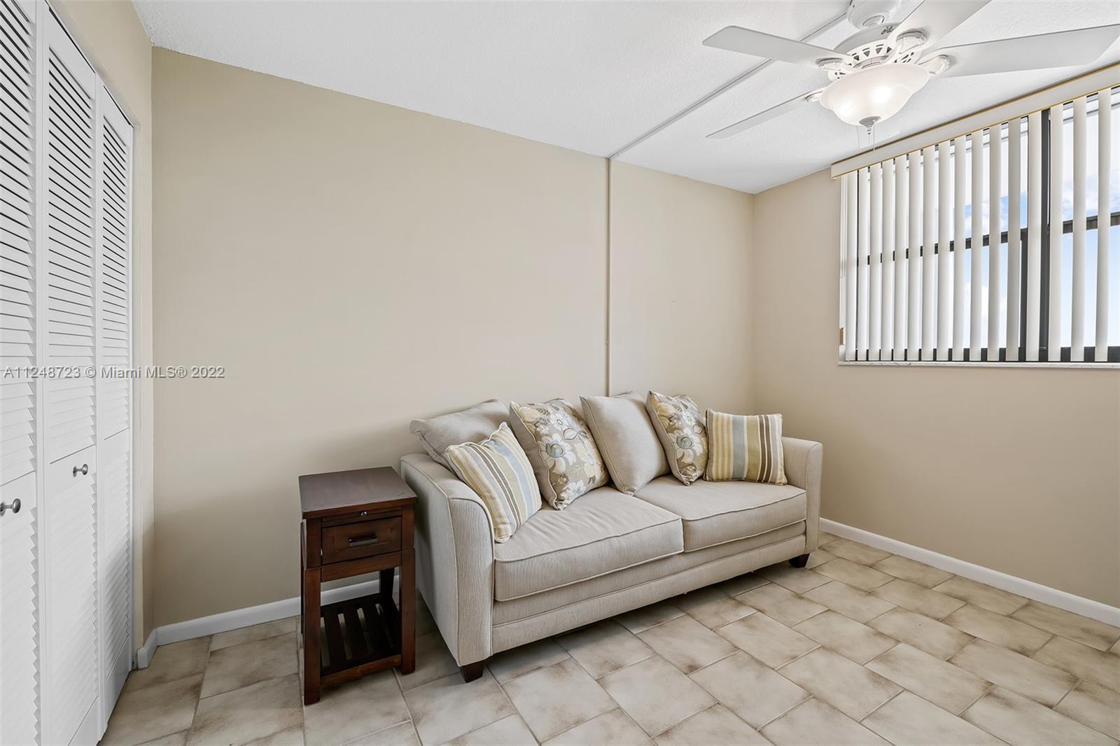 1401 North Riverside Drive, Unit 503 Pompano Beach, FL 33062 - Photo 23 of 30 a living room with furniture and a window