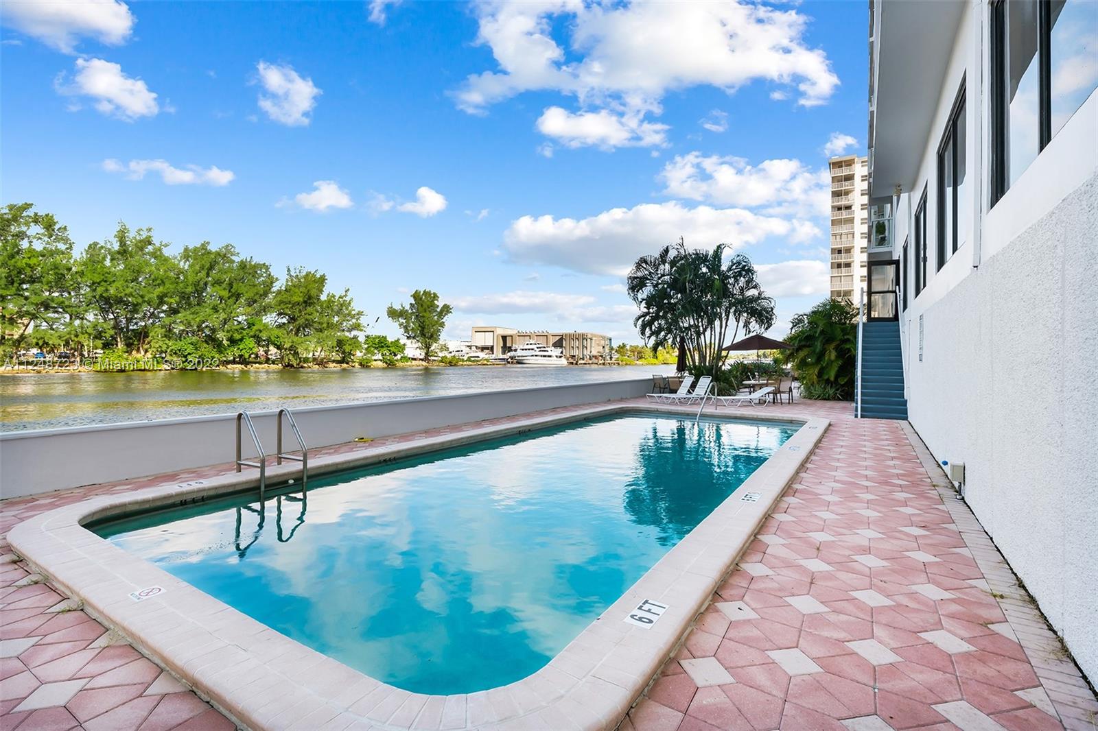 1401 North Riverside Drive, Unit 503 Pompano Beach, FL 33062 - Photo 27 of 30 a view of a swimming pool with a terrace