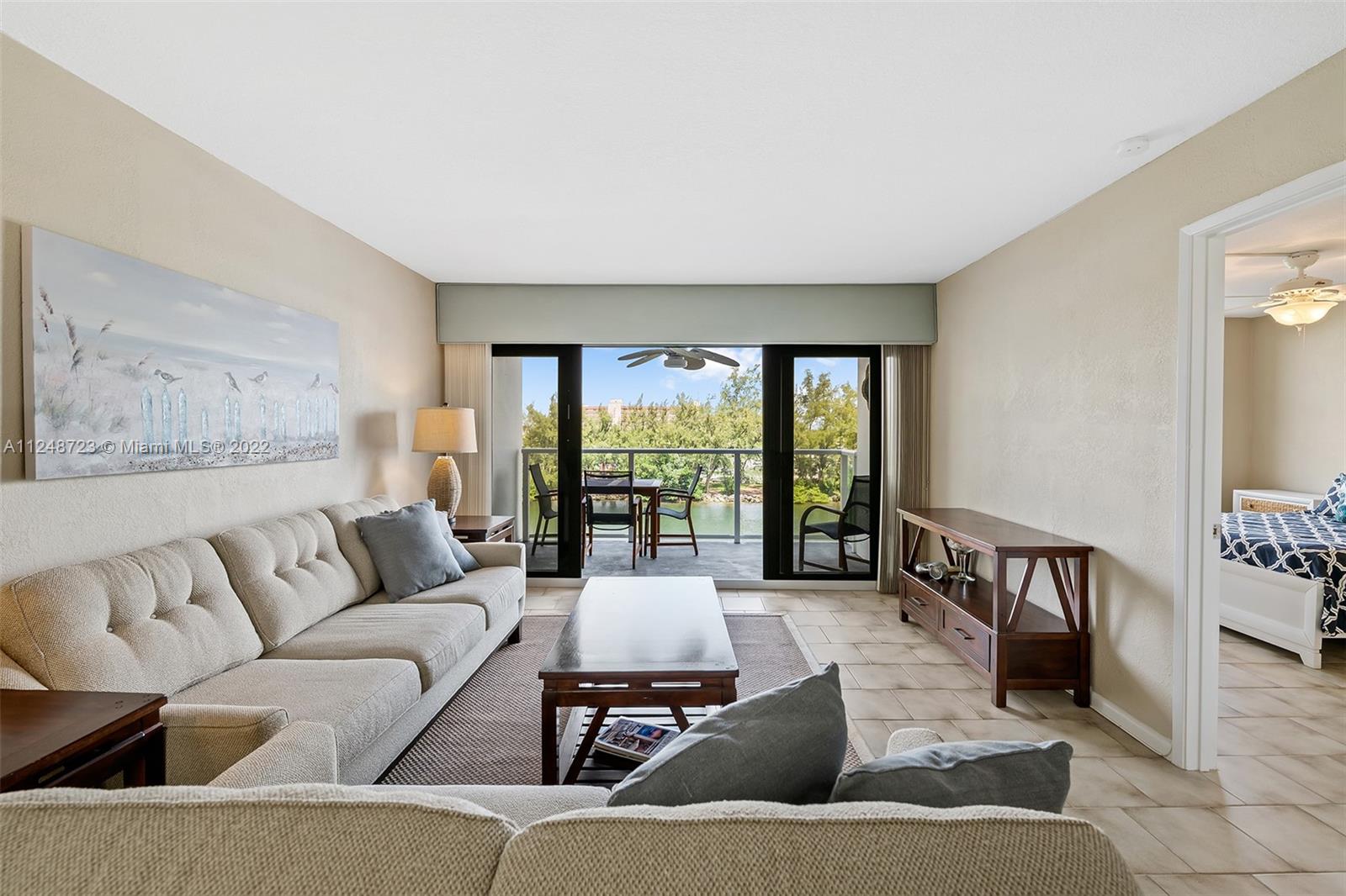 1401 North Riverside Drive, Unit 503 Pompano Beach, FL 33062 - Photo 6 of 30 a living room with furniture and a large window