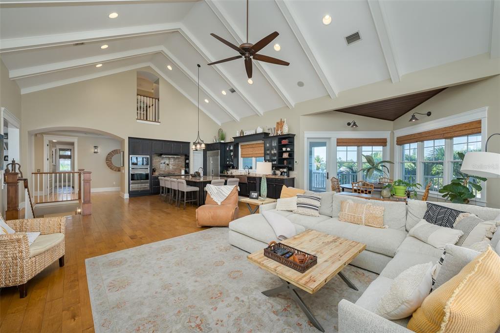 526 56th Street Holmes Beach, FL 34217 - Photo 24 of 99 a living room with furniture kitchen view and a large window