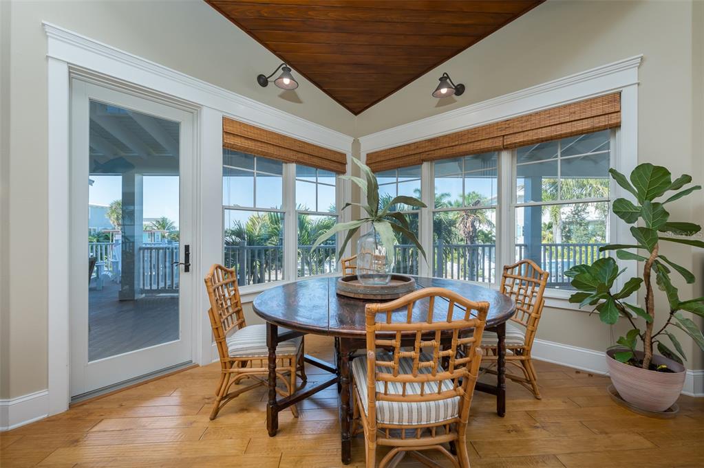 526 56th Street Holmes Beach, FL 34217 - Photo 25 of 99 a view of a dining room with furniture window and outside view