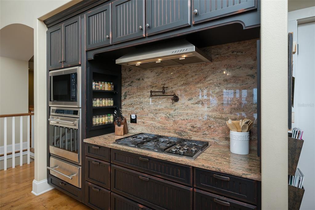 526 56th Street Holmes Beach, FL 34217 - Photo 29 of 99 a kitchen with a stove and a microwave