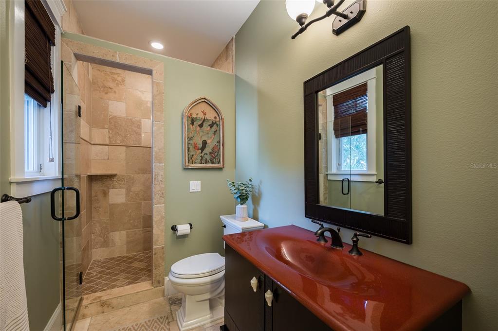 526 56th Street Holmes Beach, FL 34217 - Photo 42 of 99 a bathroom with a sink toilet and shower