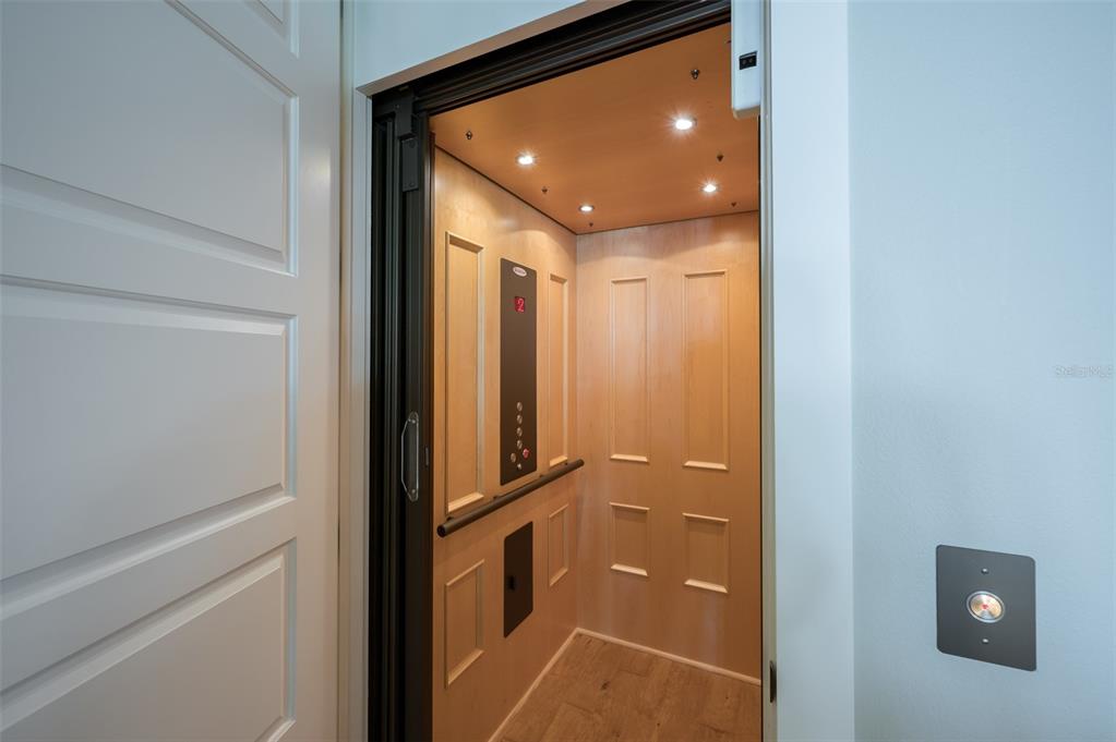 526 56th Street Holmes Beach, FL 34217 - Photo 56 of 99 a bathroom with a mirror and a shower