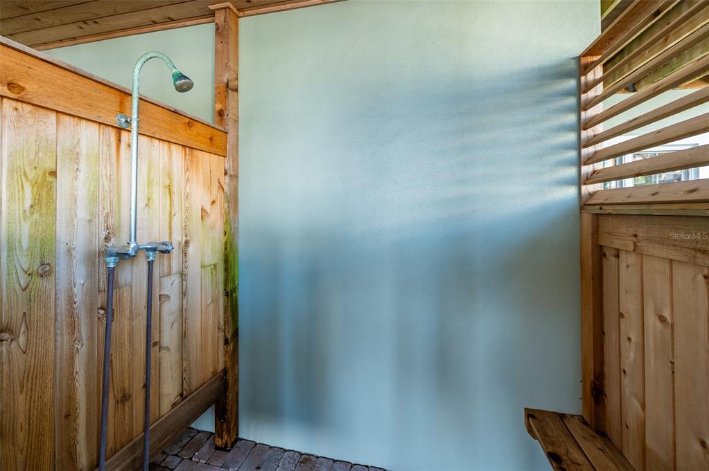 526 56th Street Holmes Beach, FL 34217 - Photo 70 of 99 a bathroom with a shower and a window