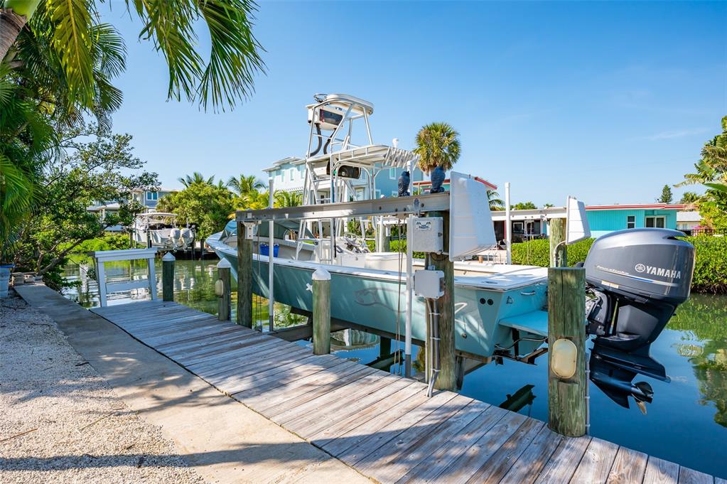 526 56th Street Holmes Beach, FL 34217 - Photo 73 of 99 a view of a dining room with furniture and wooden floor