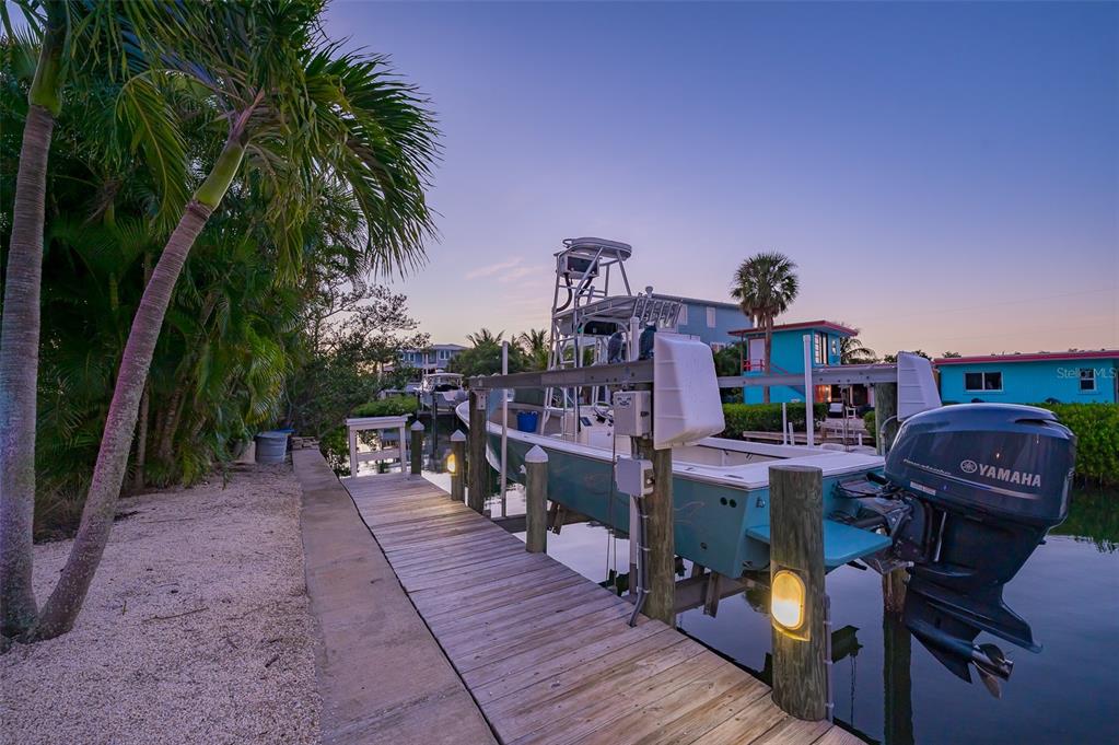 526 56th Street Holmes Beach, FL 34217 - Photo 87 of 99 a front view of a house with yard and sitting area