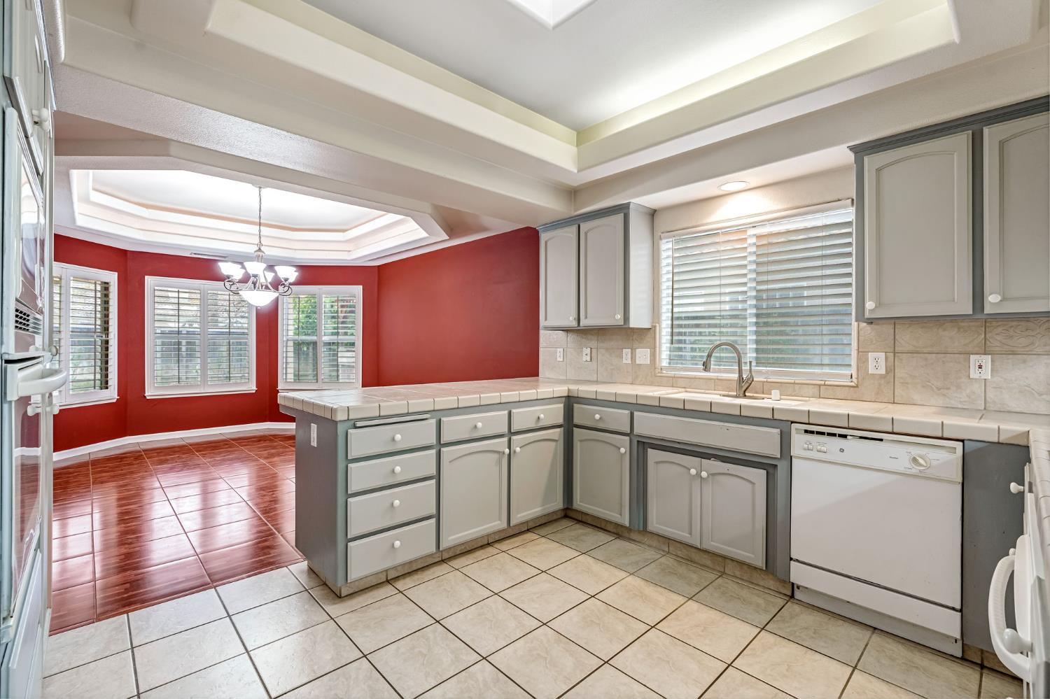 3410 Doubletree Way Madera, CA 93637 - Photo 15 of 34 a kitchen with sink cabinets and window