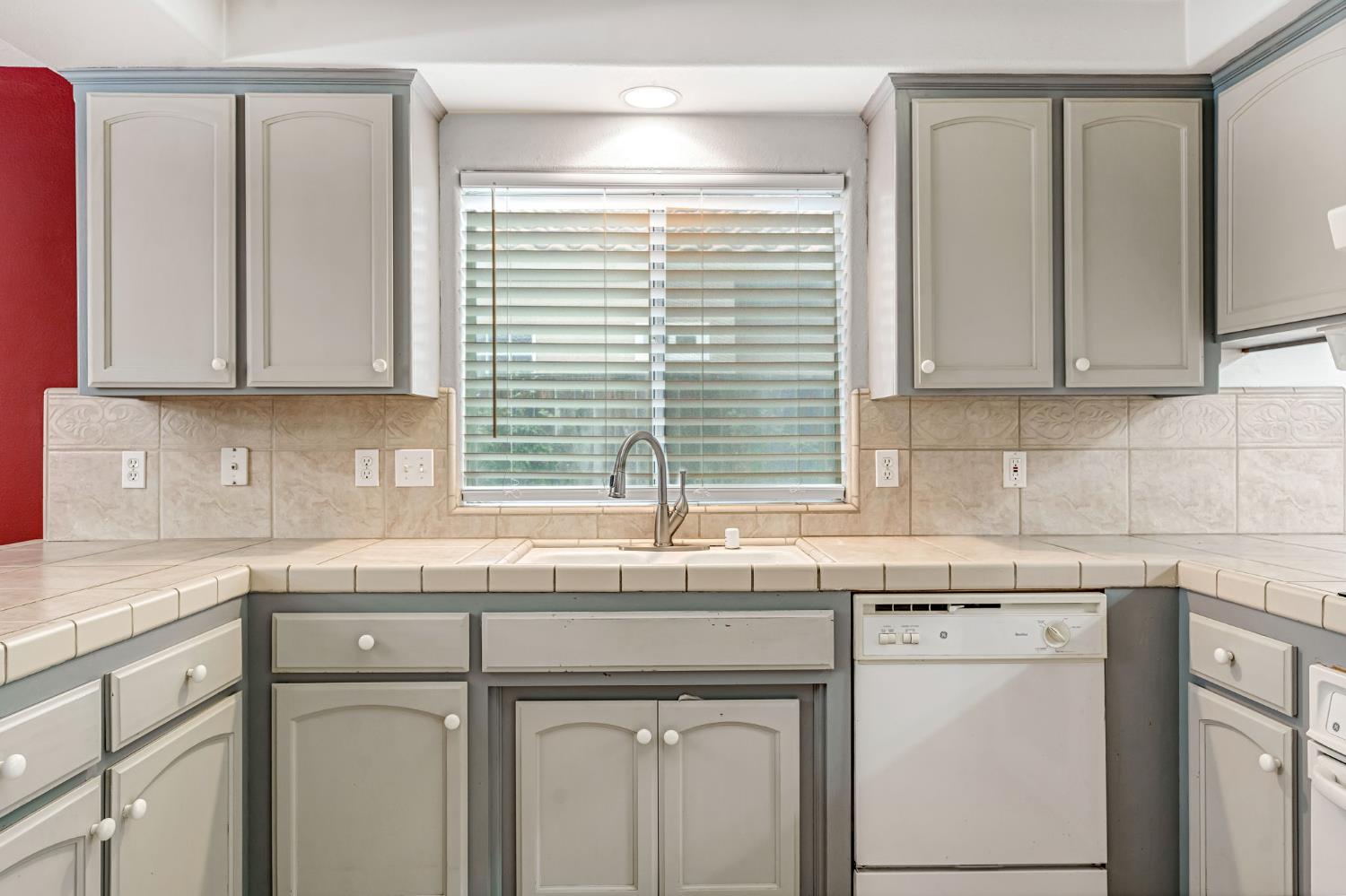 3410 Doubletree Way Madera, CA 93637 - Photo 16 of 34 a kitchen with stainless steel appliances granite countertop a sink and a white cabinets