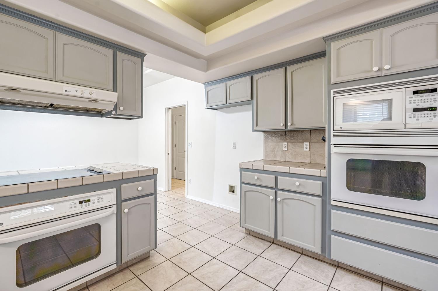 3410 Doubletree Way Madera, CA 93637 - Photo 17 of 34 a kitchen with cabinets stainless steel appliances and sink