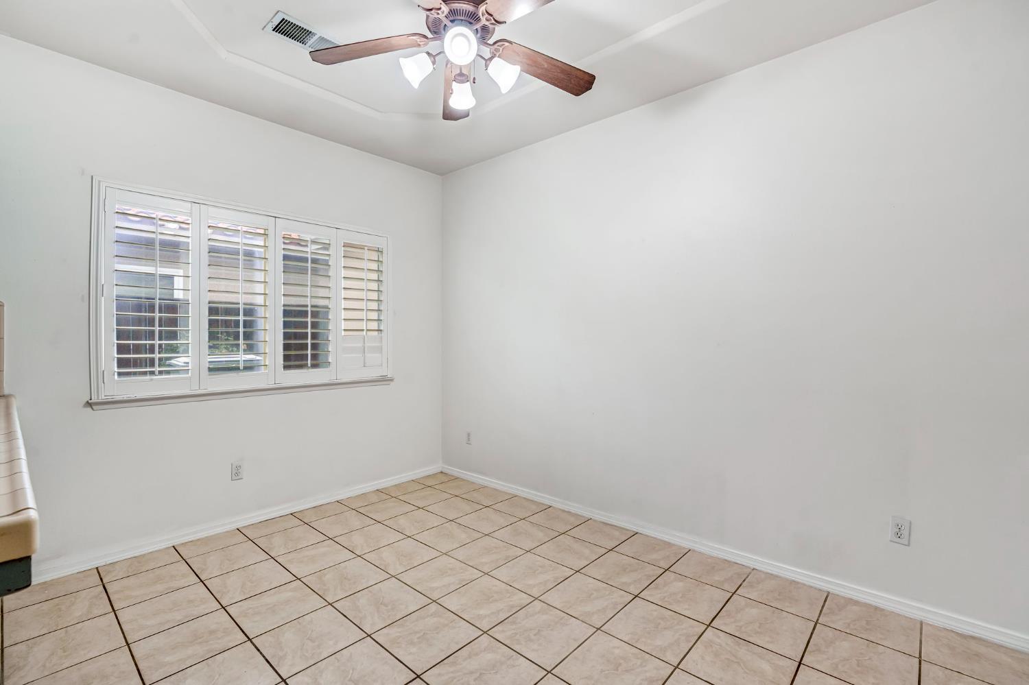 3410 Doubletree Way Madera, CA 93637 - Photo 19 of 34 a view of an empty room with a window