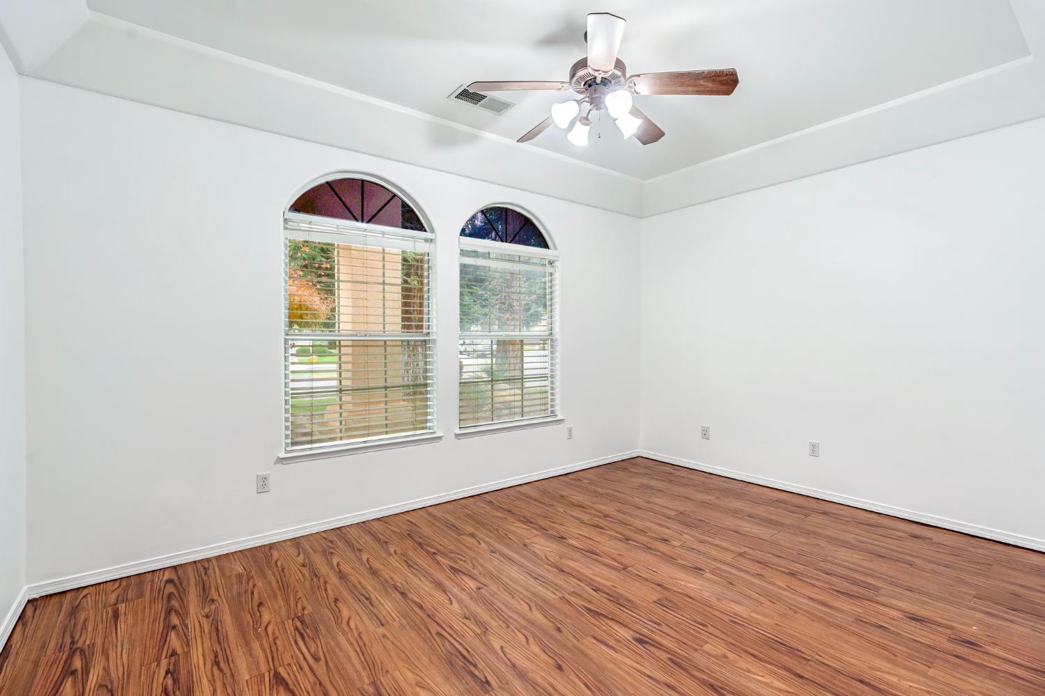 3410 Doubletree Way Madera, CA 93637 - Photo 24 of 34 an empty room with a window and ceiling fan