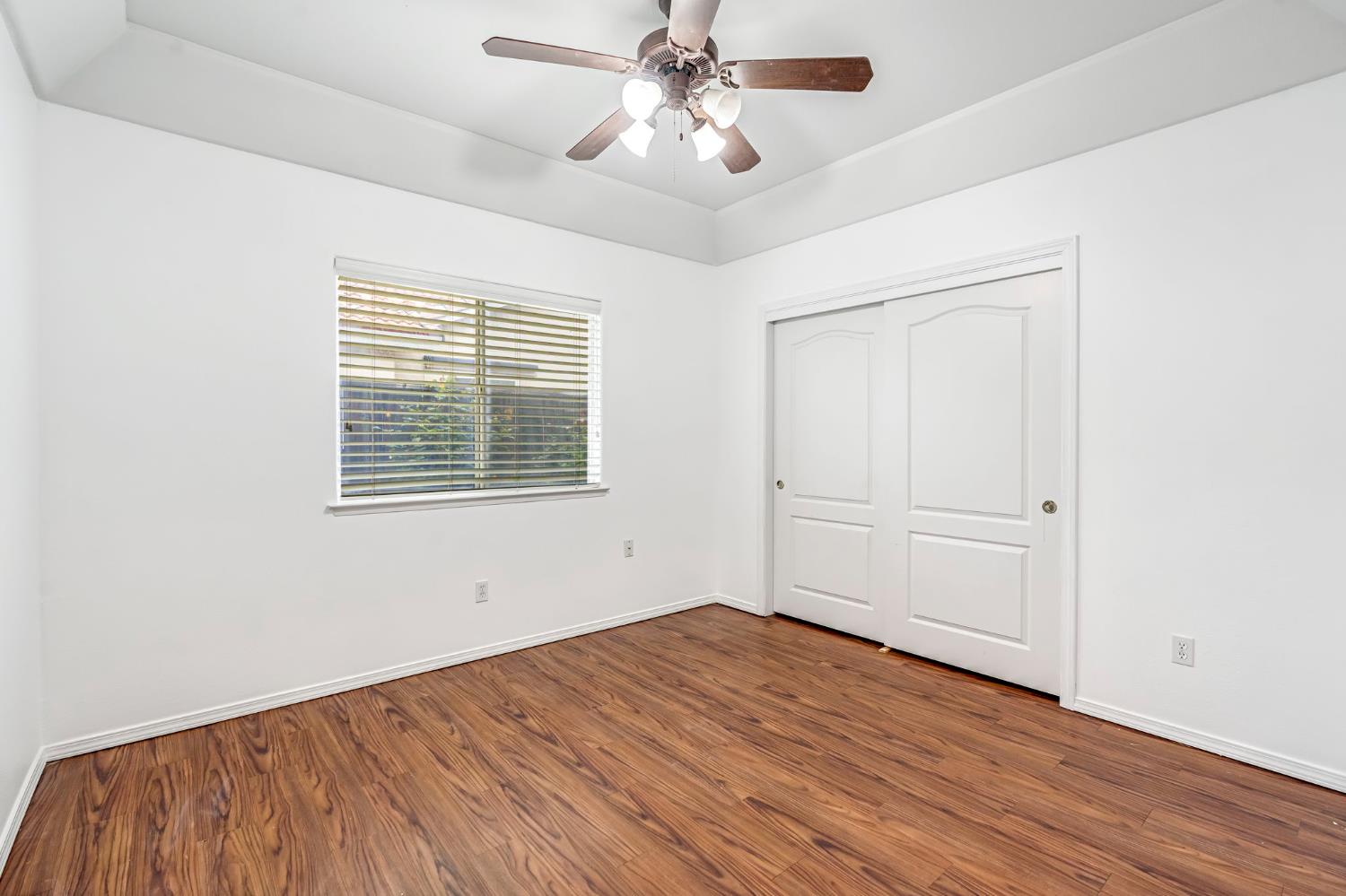 3410 Doubletree Way Madera, CA 93637 - Photo 27 of 34 a view of empty room with wooden floor and fan