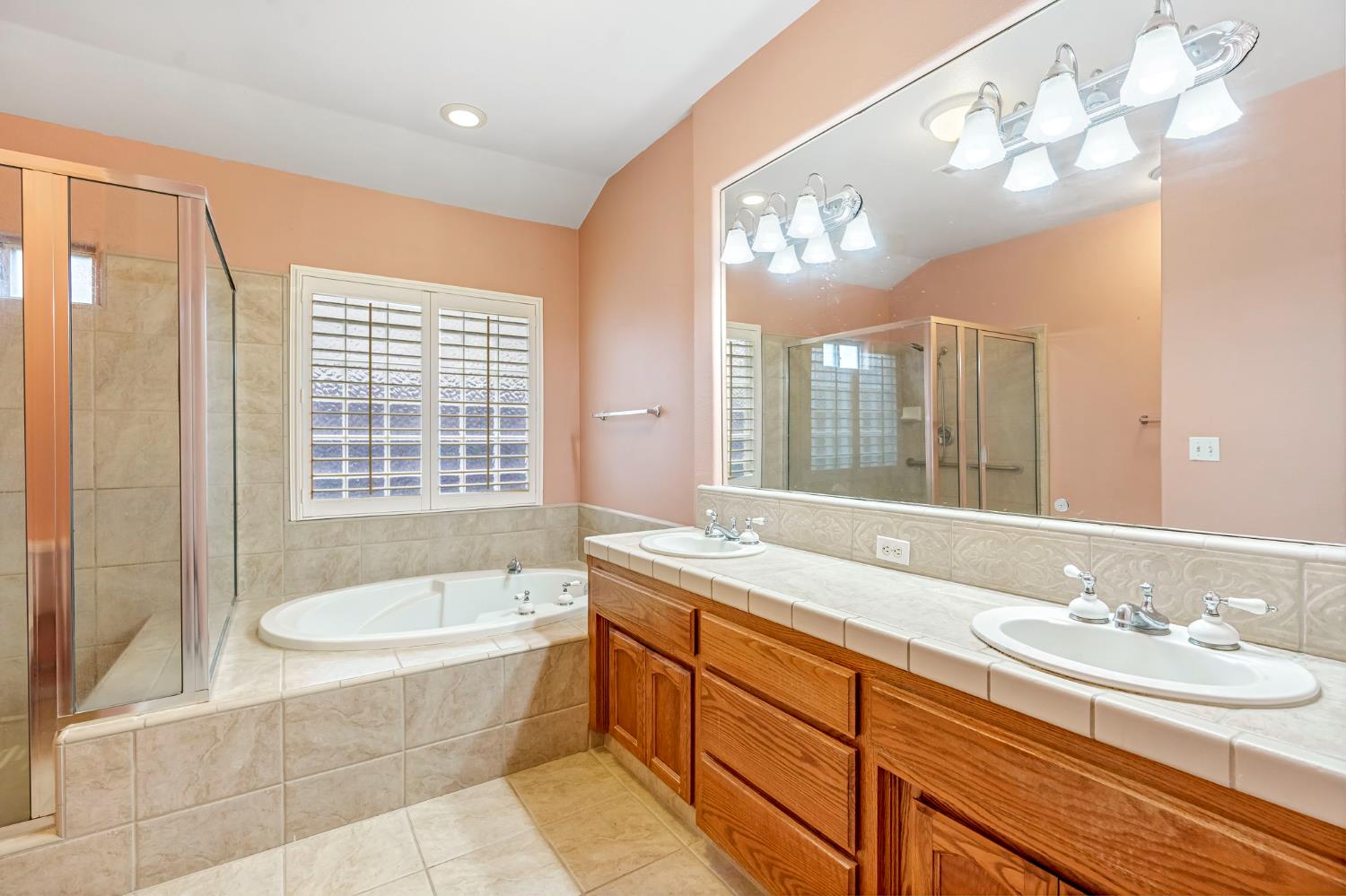 3410 Doubletree Way Madera, CA 93637 - Photo 30 of 34 a bathroom with a granite countertop sink and a large mirror