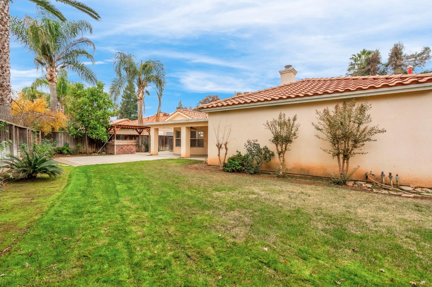3410 Doubletree Way Madera, CA 93637 - Photo 34 of 34 a front view of a house with garden