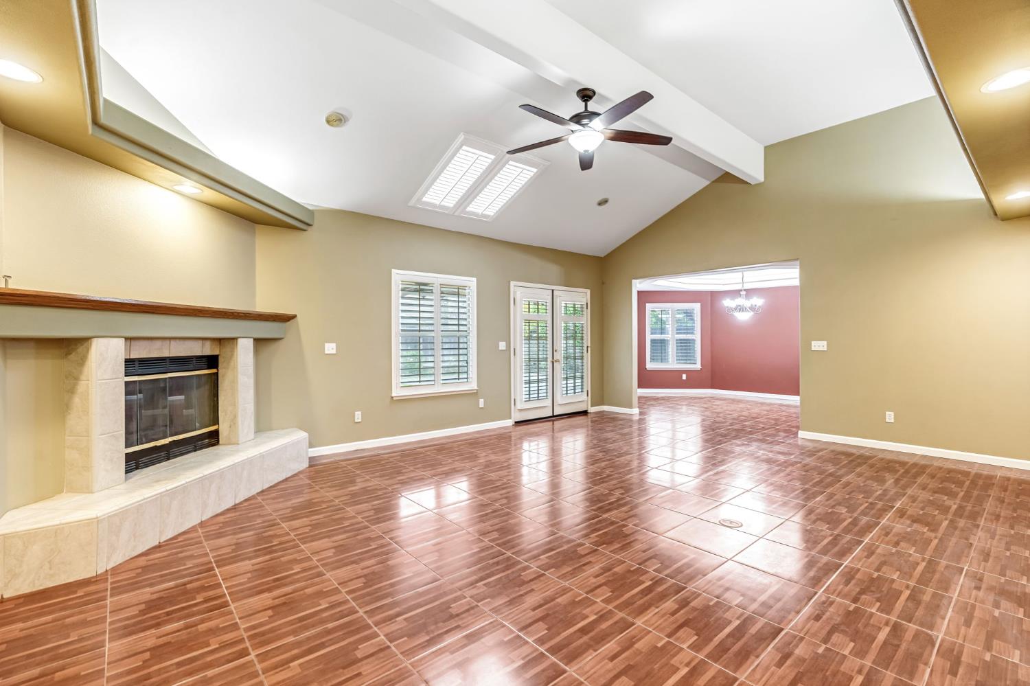 3410 Doubletree Way Madera, CA 93637 - Photo 6 of 34 a view of an empty room with a fireplace and a window