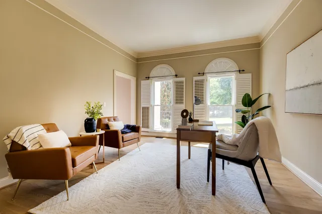 a bedroom with a bed furniture and ceiling fan