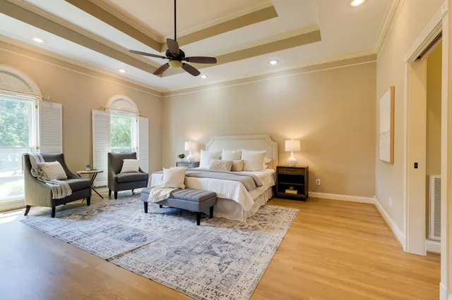 a large spacious bathroom with a large tub and large windows