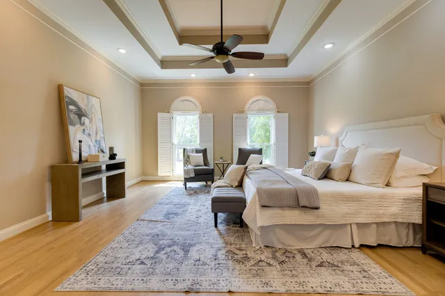 a bathroom with a granite countertop sink a large mirror and a window
