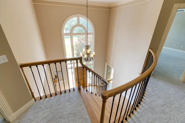 a spacious bathroom with a granite countertop sink mirror and