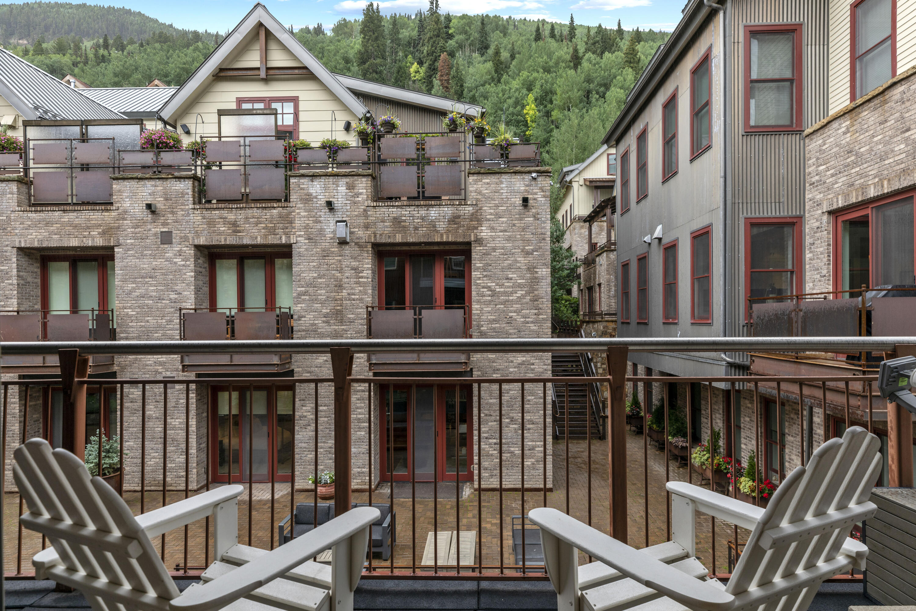 368 South Davis Street, Unit A7 Telluride, CO 81435 - Photo 5 of 14 a view of a house with wooden deck