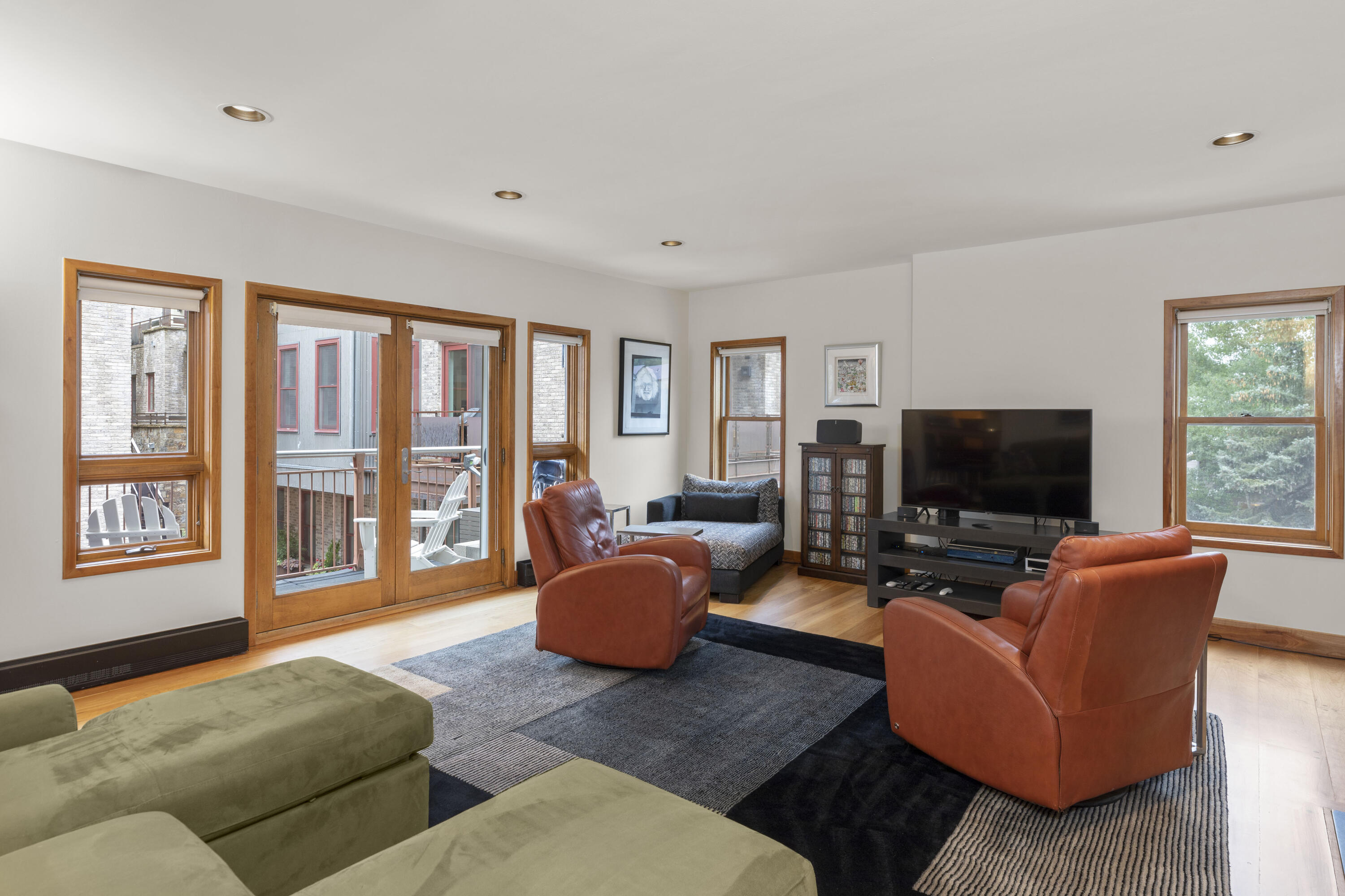 368 South Davis Street, Unit A7 Telluride, CO 81435 - Photo 7 of 14 a living room with furniture and a flat screen tv