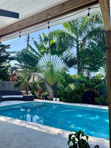 a view of a yard with a table and chair