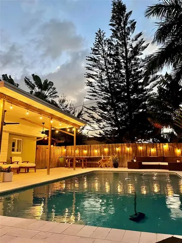 a view of swimming pool with outdoor seating