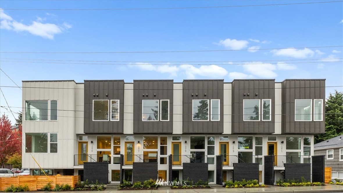 1271 North 145th Street Seattle, WA 98133 - Photo 1 of 32 a front view of a building with glass windows