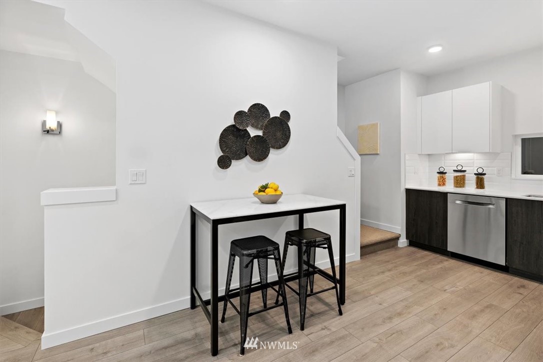 1271 North 145th Street Seattle, WA 98133 - Photo 18 of 32 a kitchen with a table and chairs in it