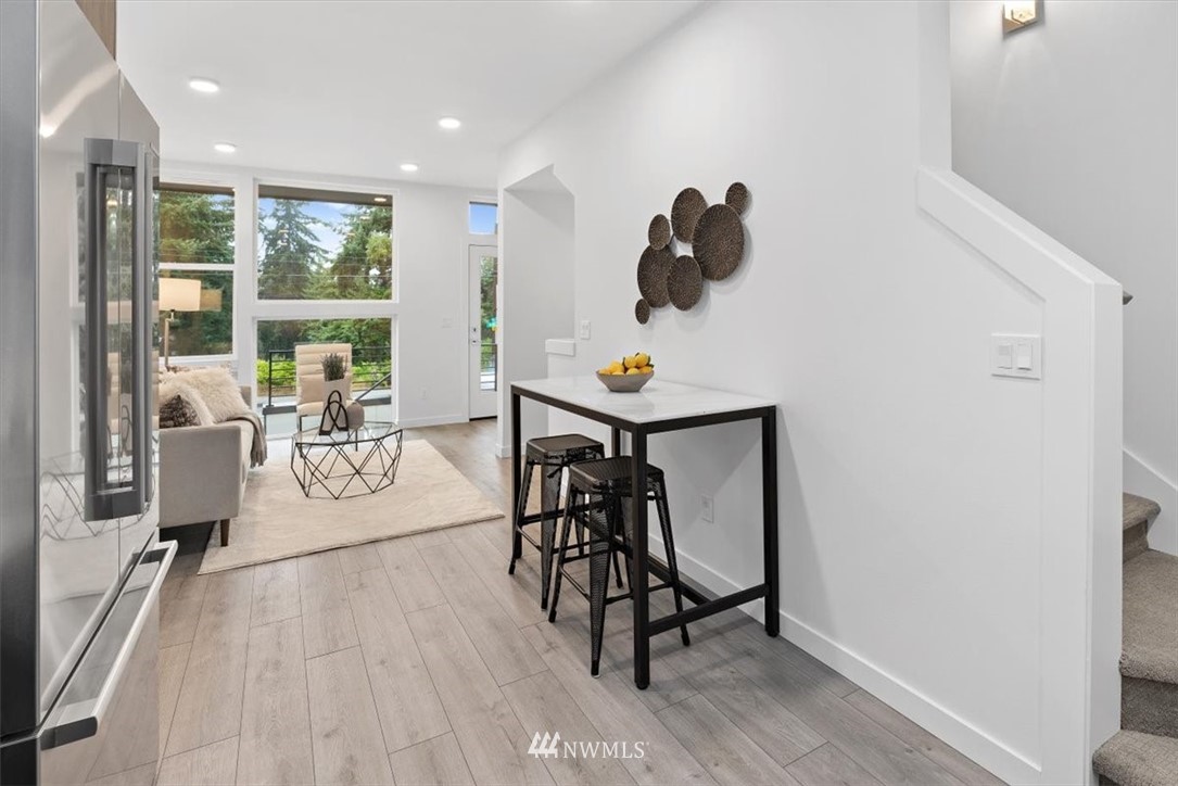 1271 North 145th Street Seattle, WA 98133 - Photo 19 of 32 a view of a livingroom with furniture and wooden floor