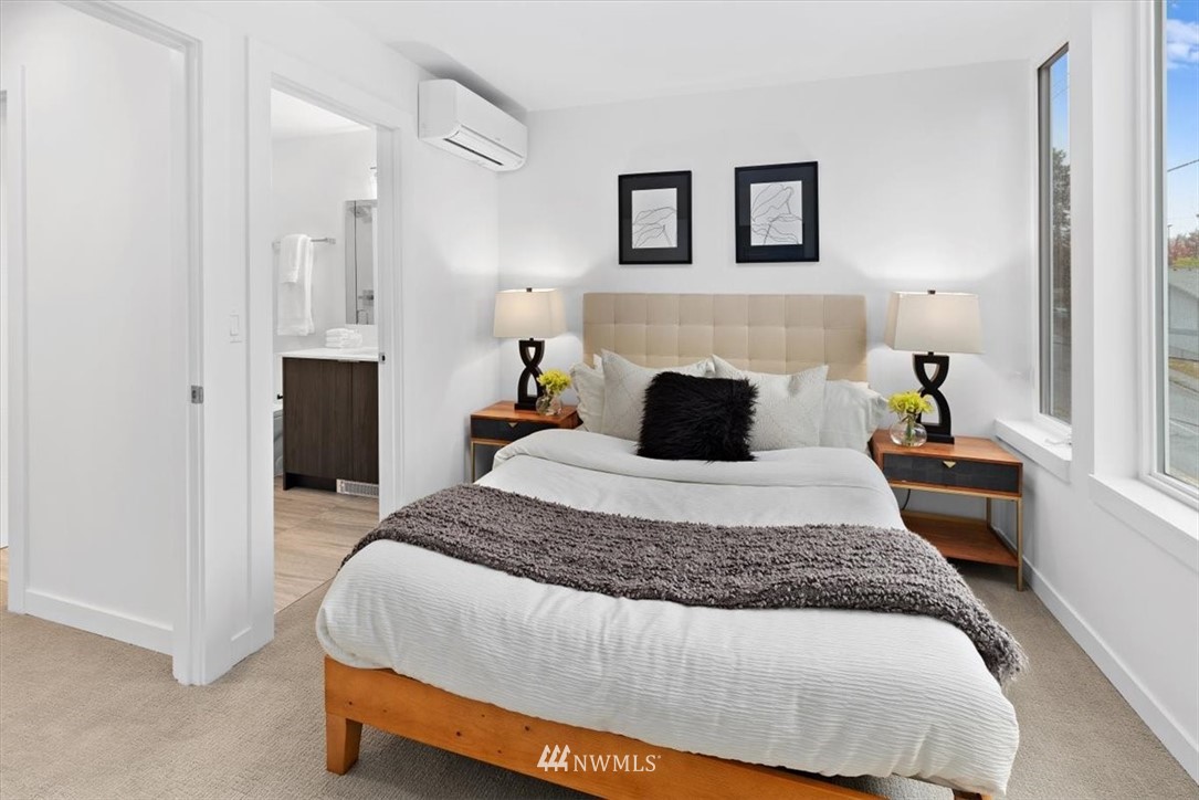 1271 North 145th Street Seattle, WA 98133 - Photo 21 of 32 a bedroom with a bed and a fireplace