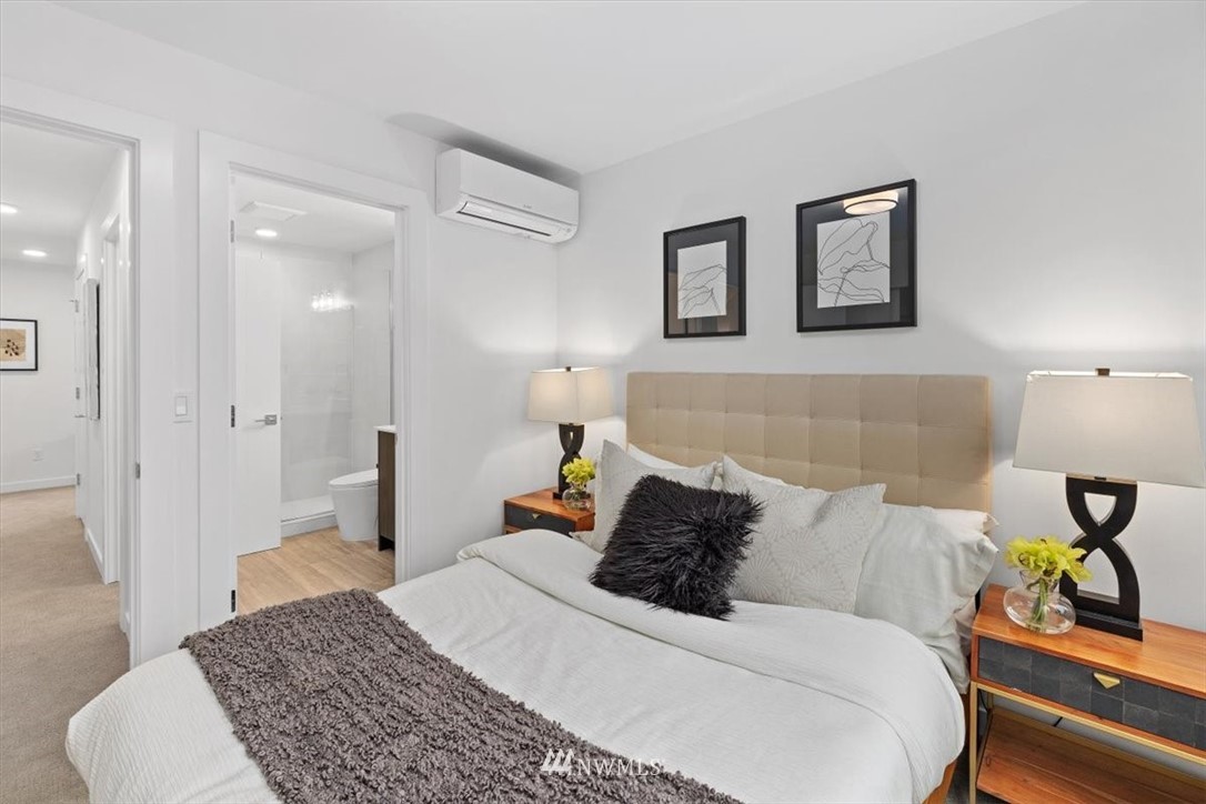 1271 North 145th Street Seattle, WA 98133 - Photo 22 of 32 a bedroom with a bed and painting on the wall