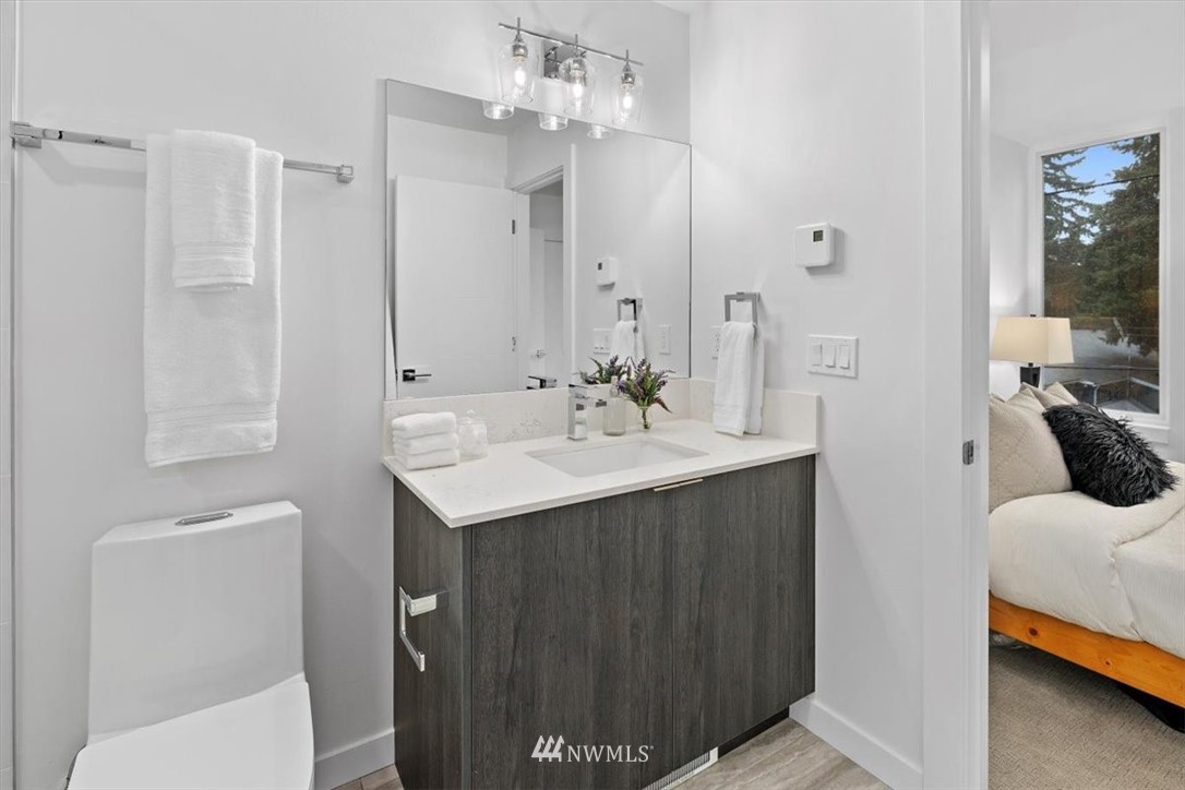 1271 North 145th Street Seattle, WA 98133 - Photo 24 of 32 a en suite bathroom with a sink and a mirror